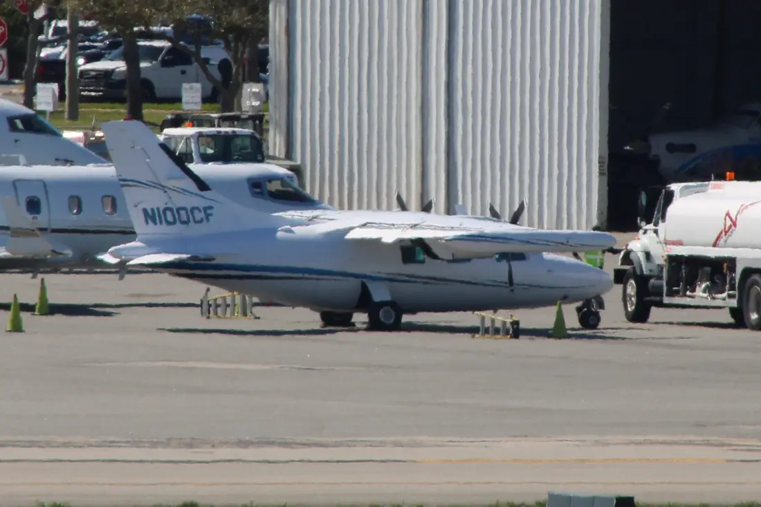 A Mitsubishi MU-2 twin turboprop on an airport ramp