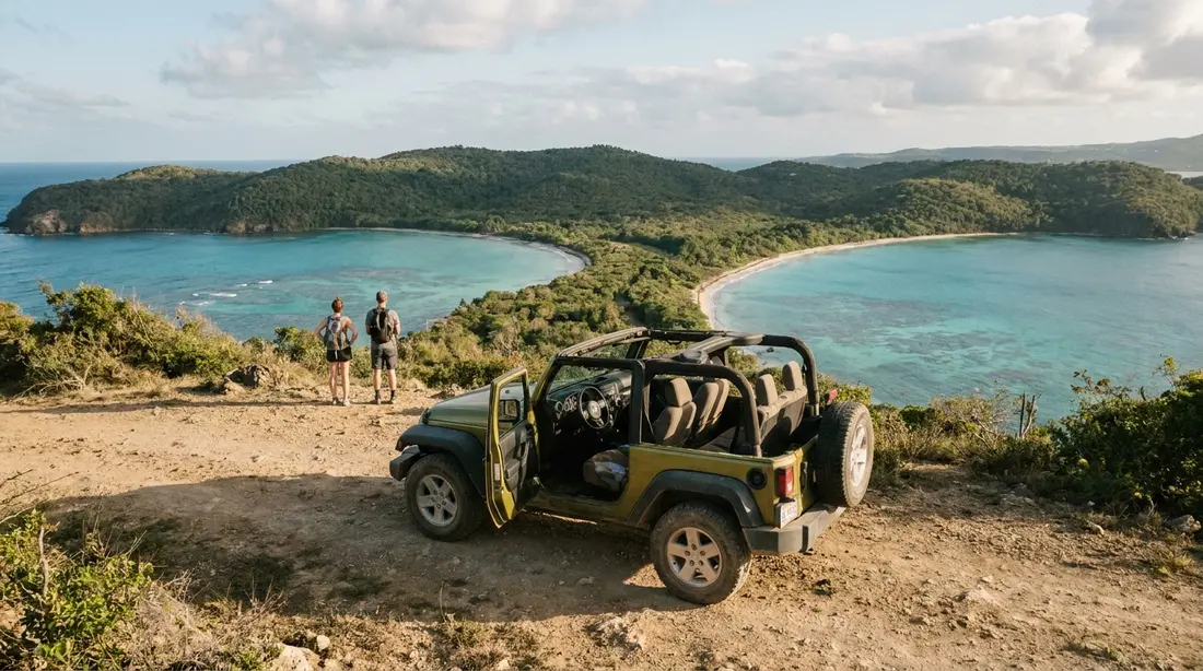 A jeep parked at a coastal overlook above two bays