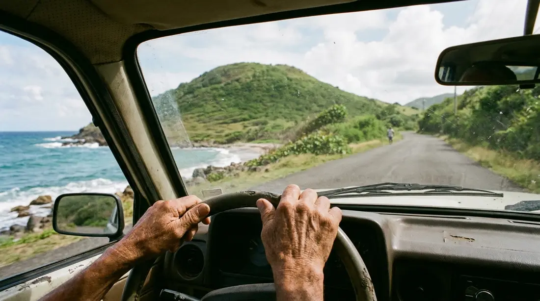 Driving on the left along a quiet coastal road