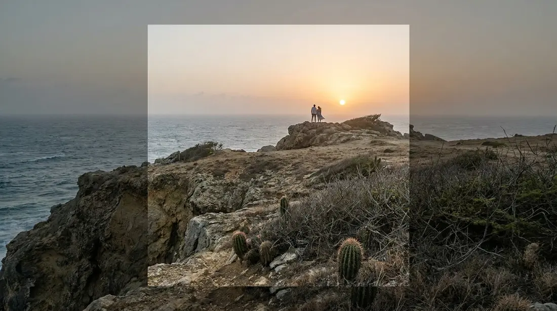 Sunrise breaking over a rocky, windswept headland