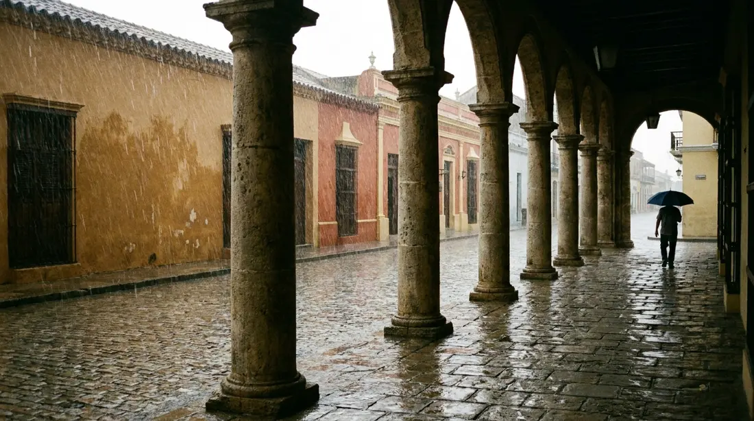 Rain on a colonial arcade with wet cobbles