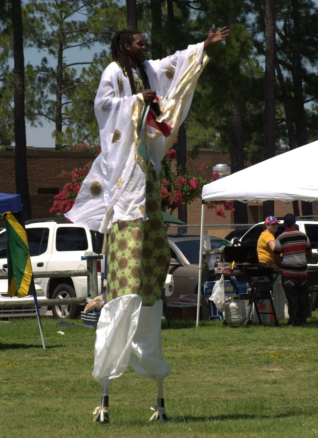 A moko jumbie stilt dancer at a Caribbean heritage festival