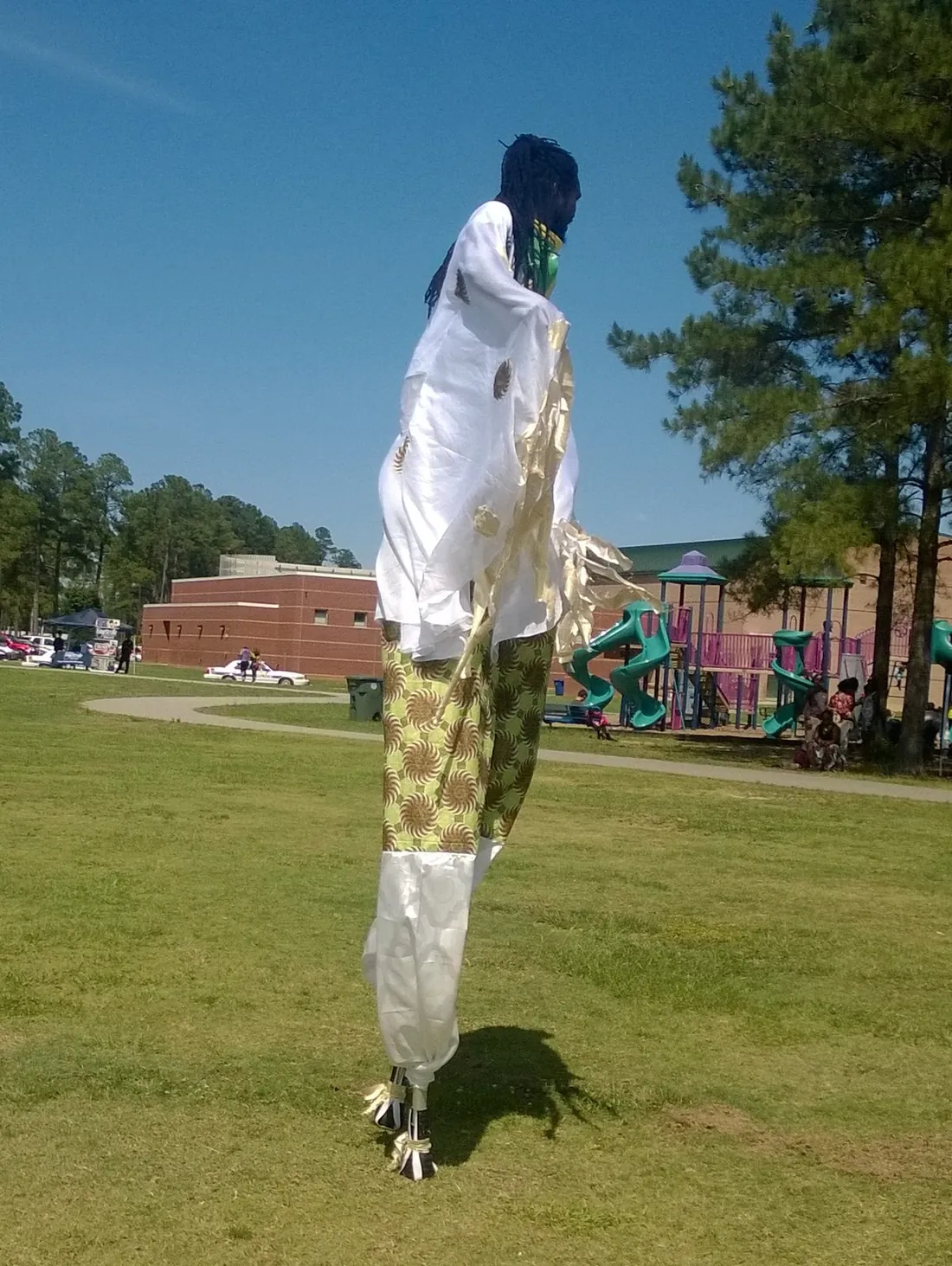 A moko jumbie stilt dancer at a Caribbean heritage festival