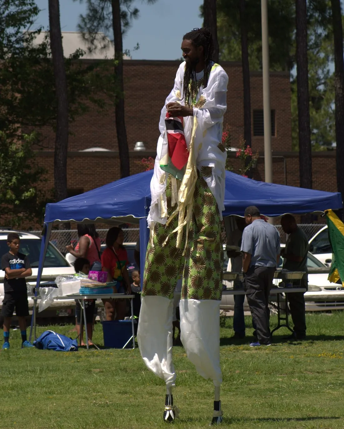 A moko jumbie stilt dancer at a Caribbean heritage festival